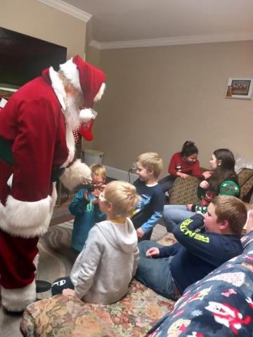 Santa John and Mrs. Claus with families, photo 1 of 21